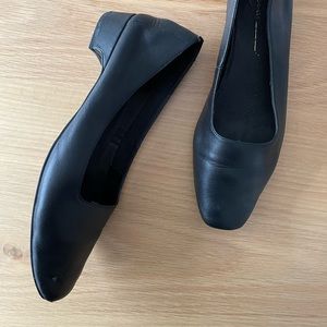 Intentionally Blank black leather shoes.